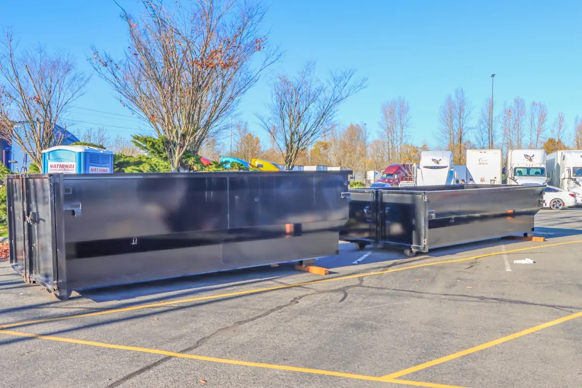 Professional dumpster rental service with roll-off container on residential driveway in Foster City